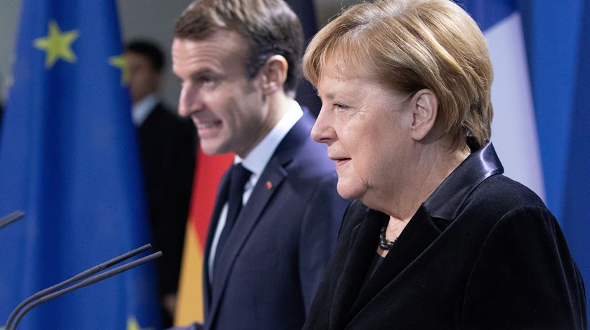Macron e Merkel. Foto: Omer Messinger/EPA